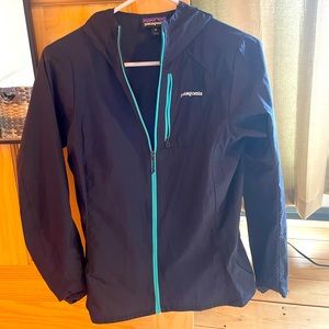Patagonia thin running jacket. Size XS. Color is dark/light blue.